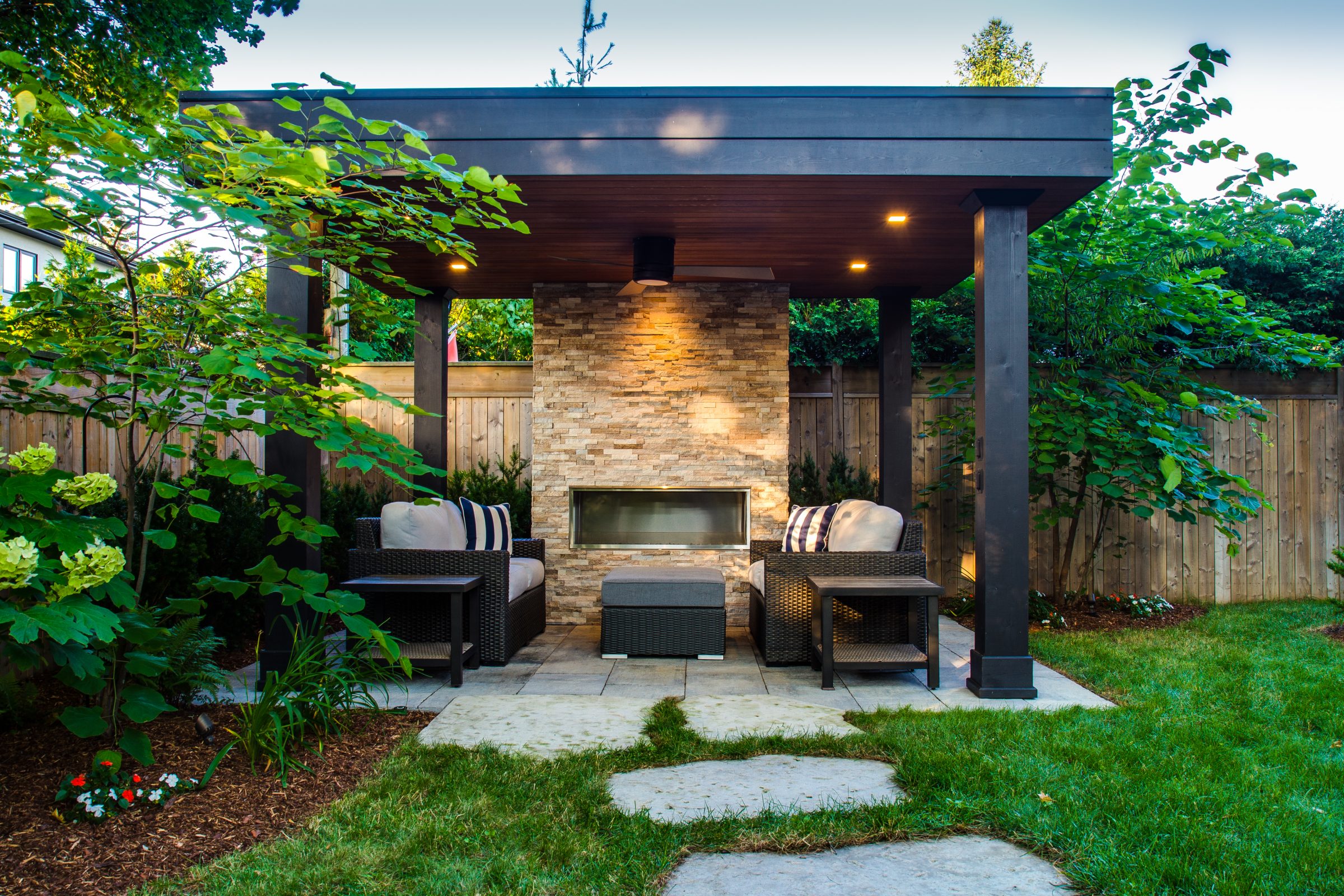 Outdoor patio with fireplace and seating area