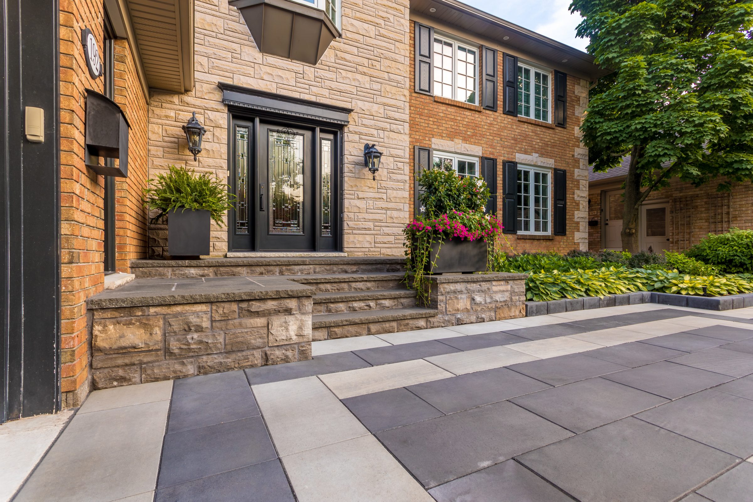 Brick house with front steps and garden