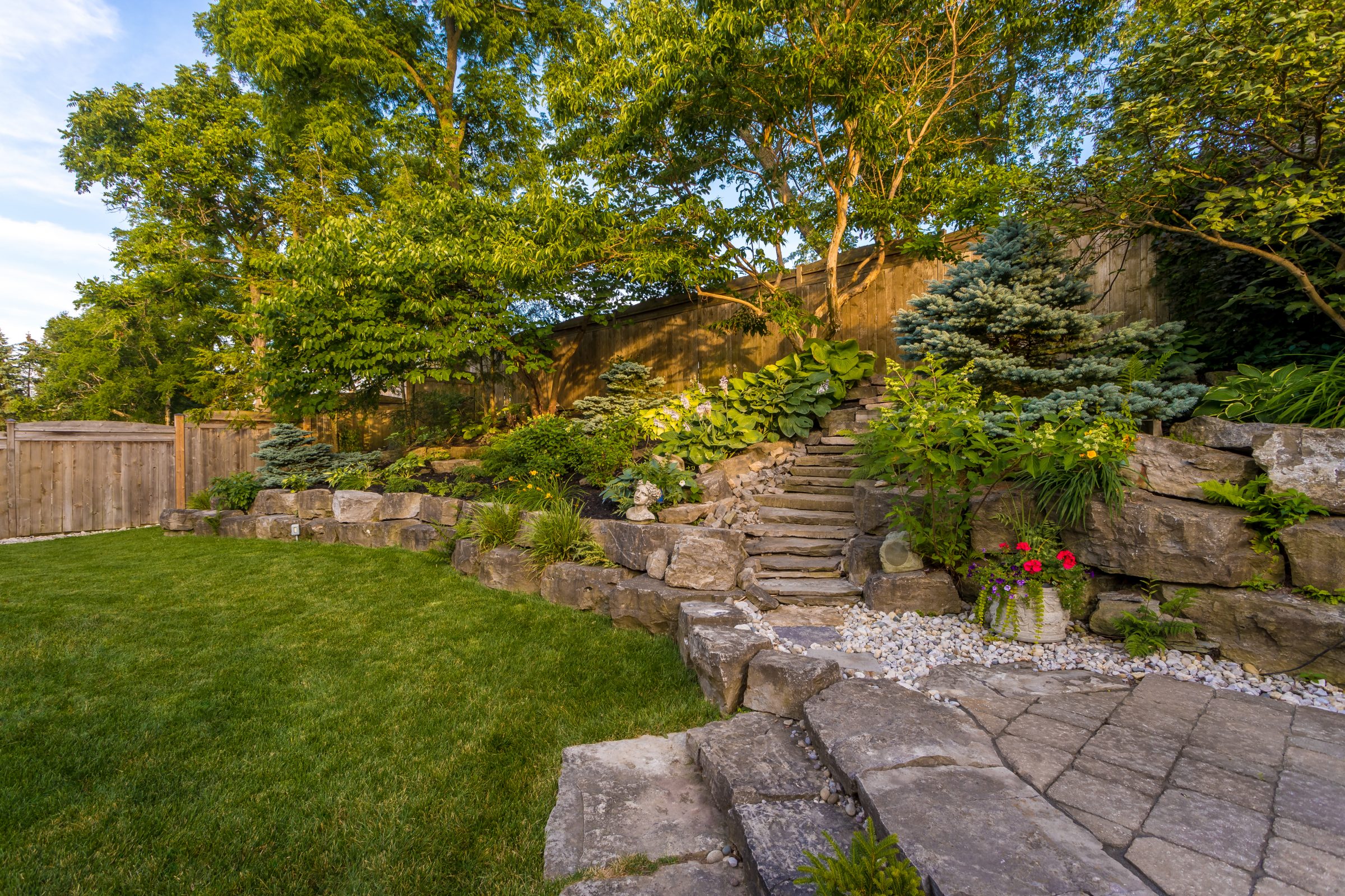 Lush garden with stone path and stairs