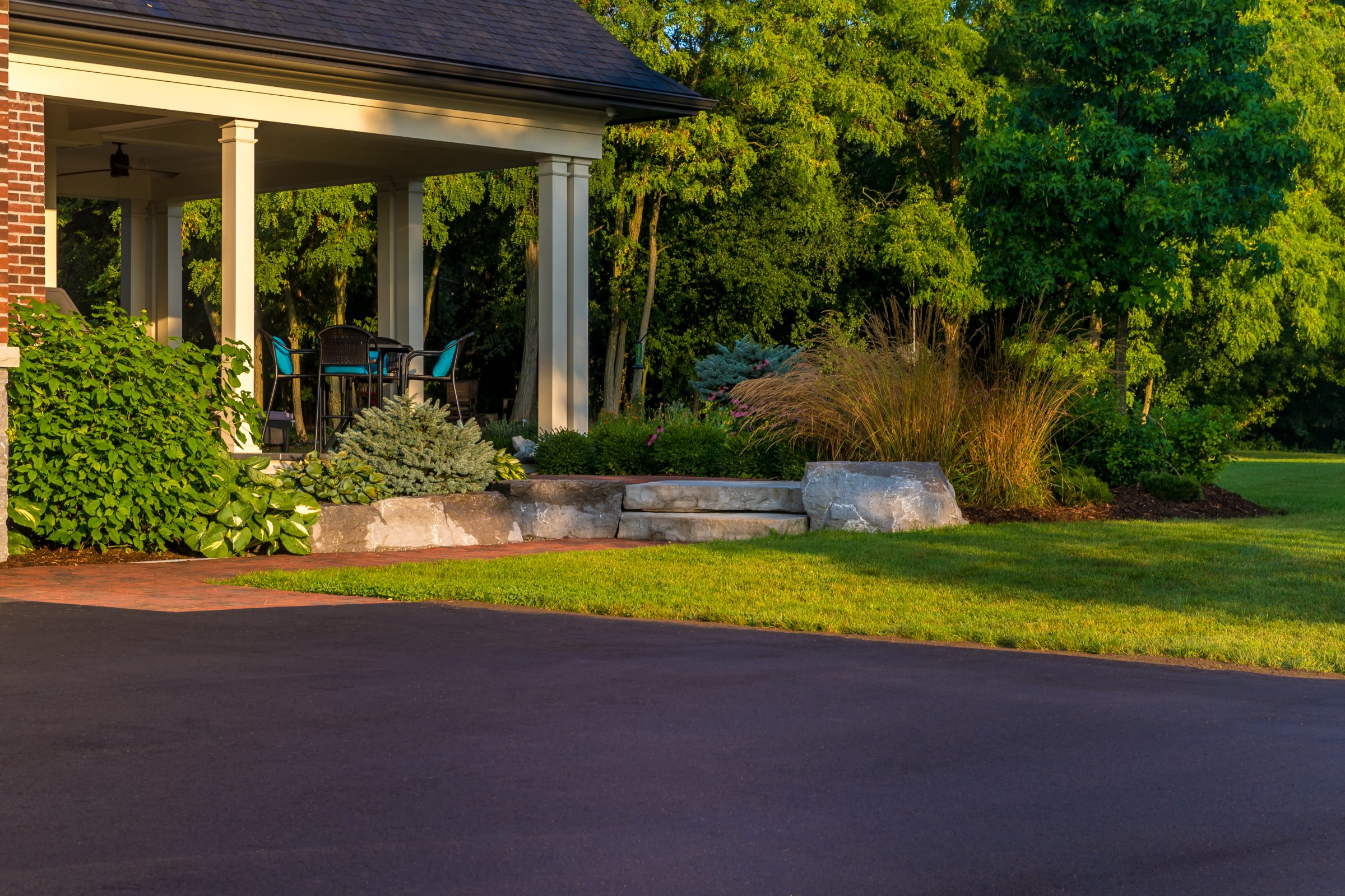 Peaceful patio surrounded by lush green garden