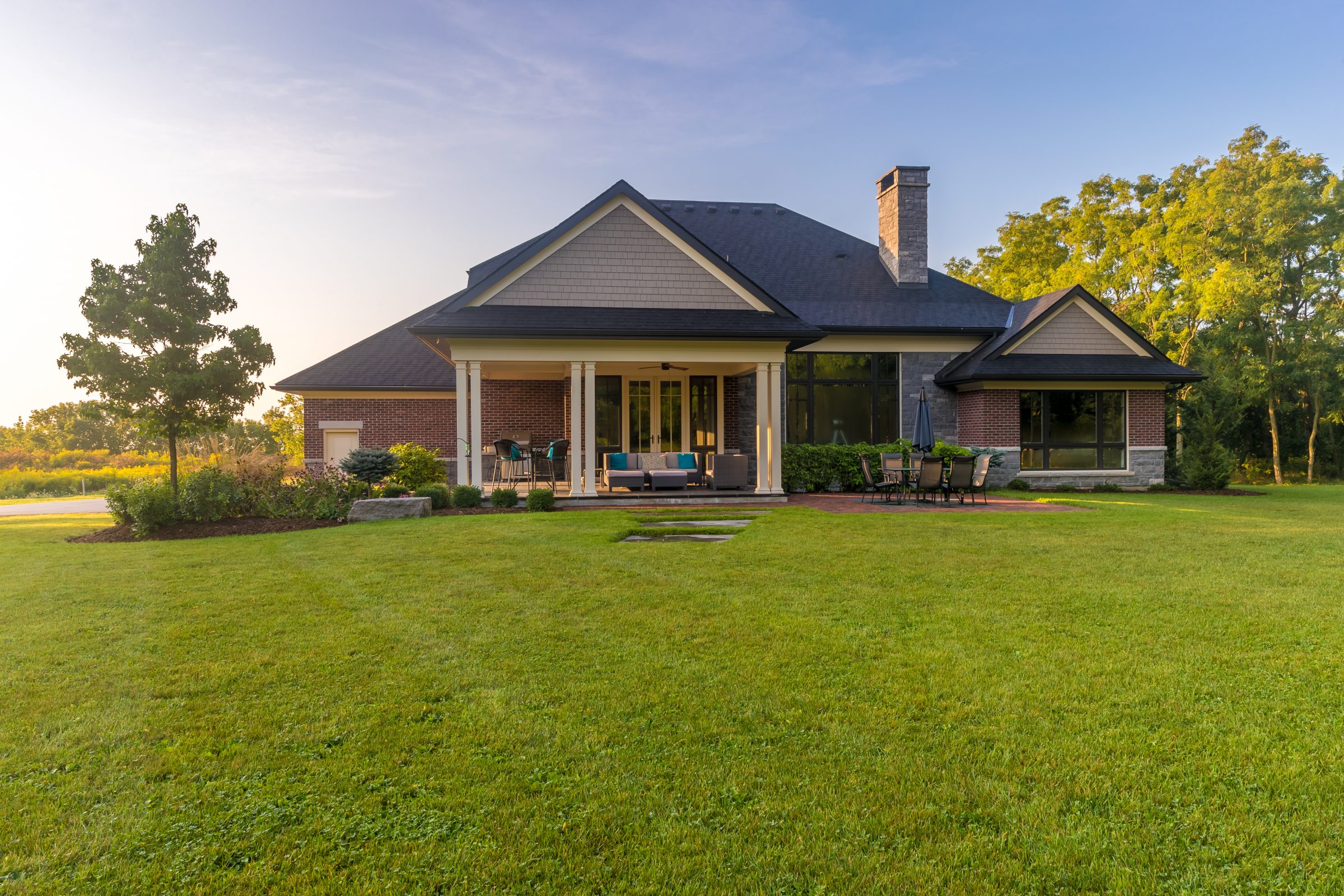 Modern house with spacious lawn and patio.