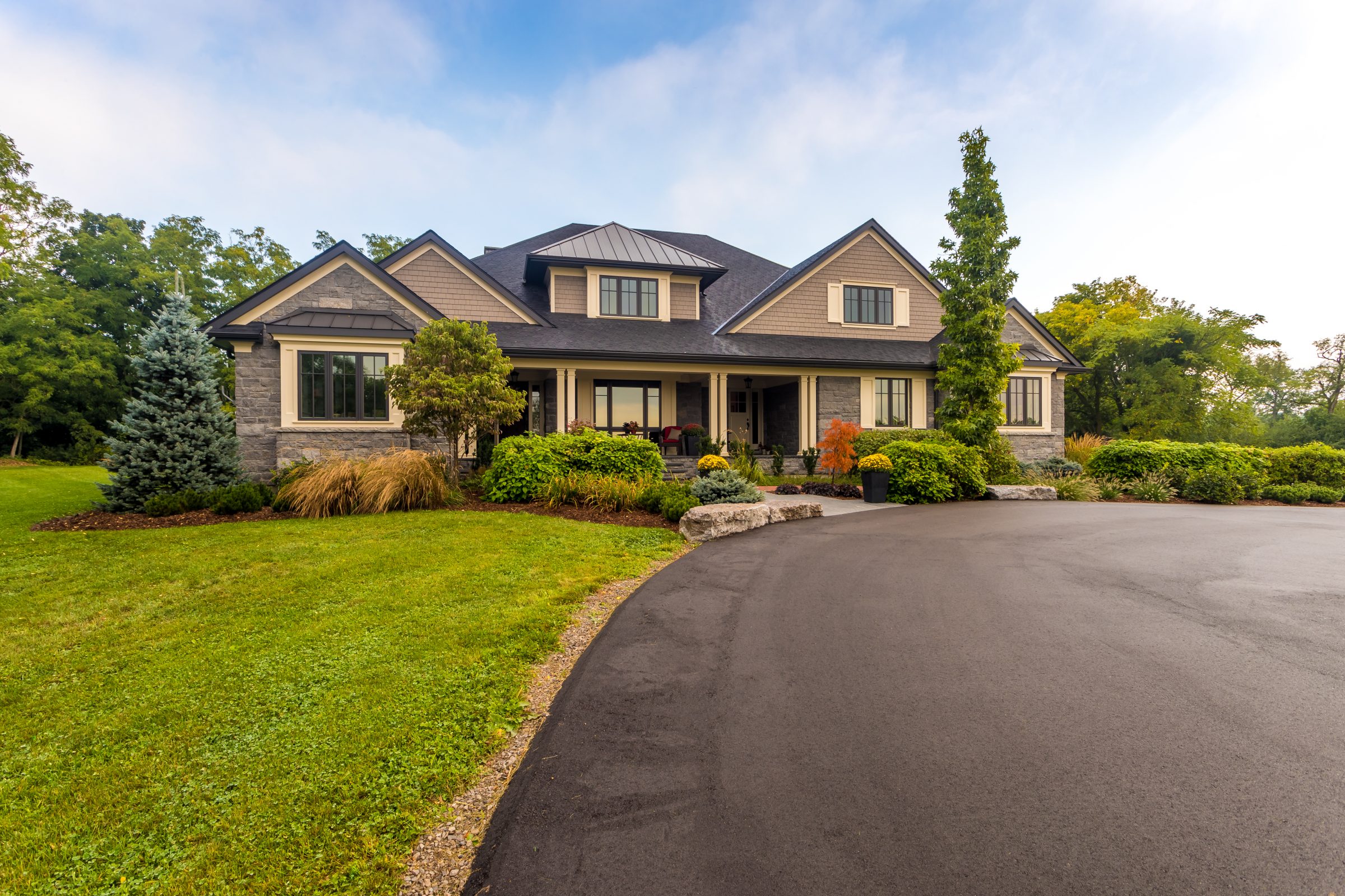 Modern suburban house with landscaped front yard.
