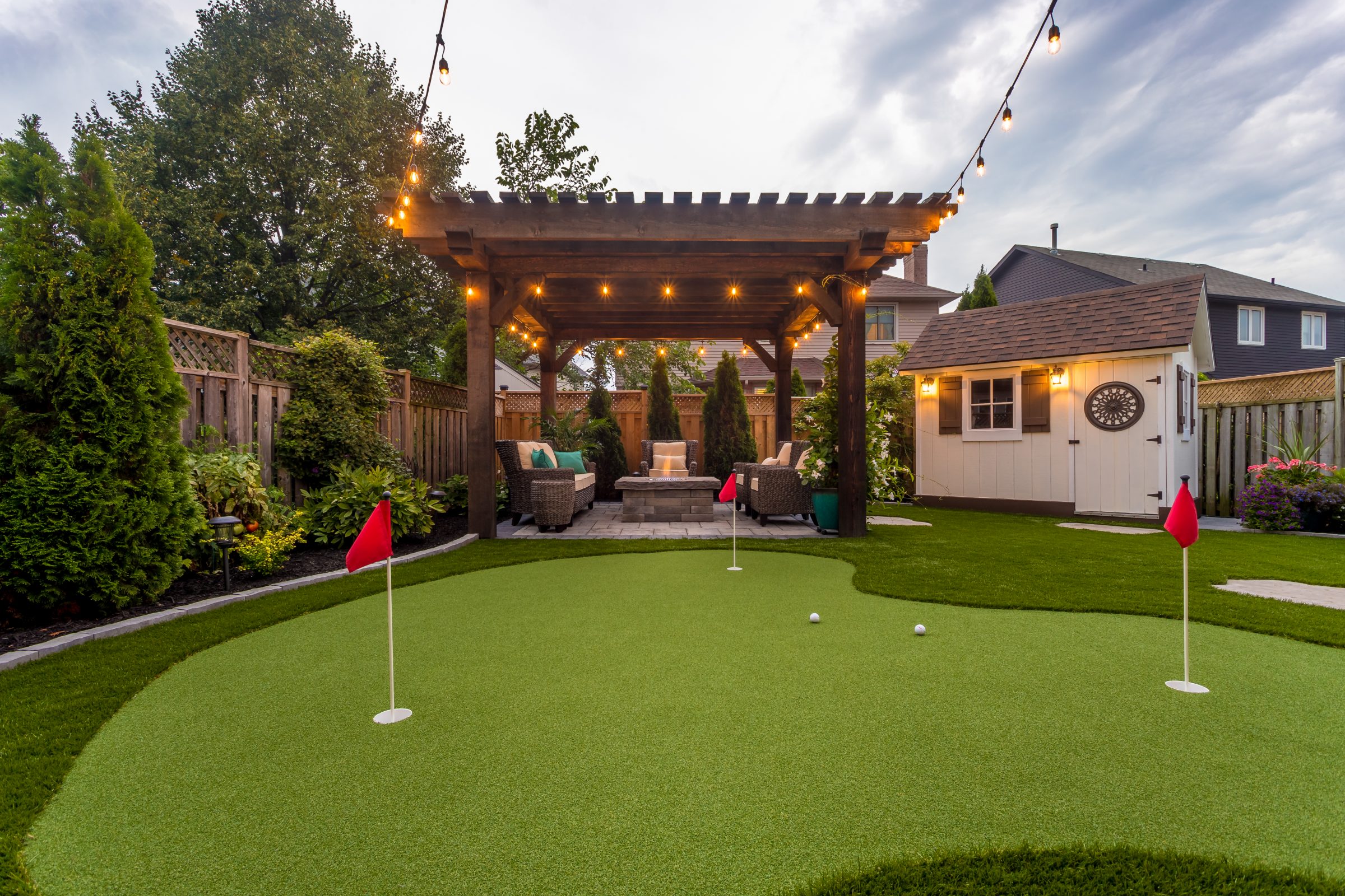 Backyard with pergola and putting green
