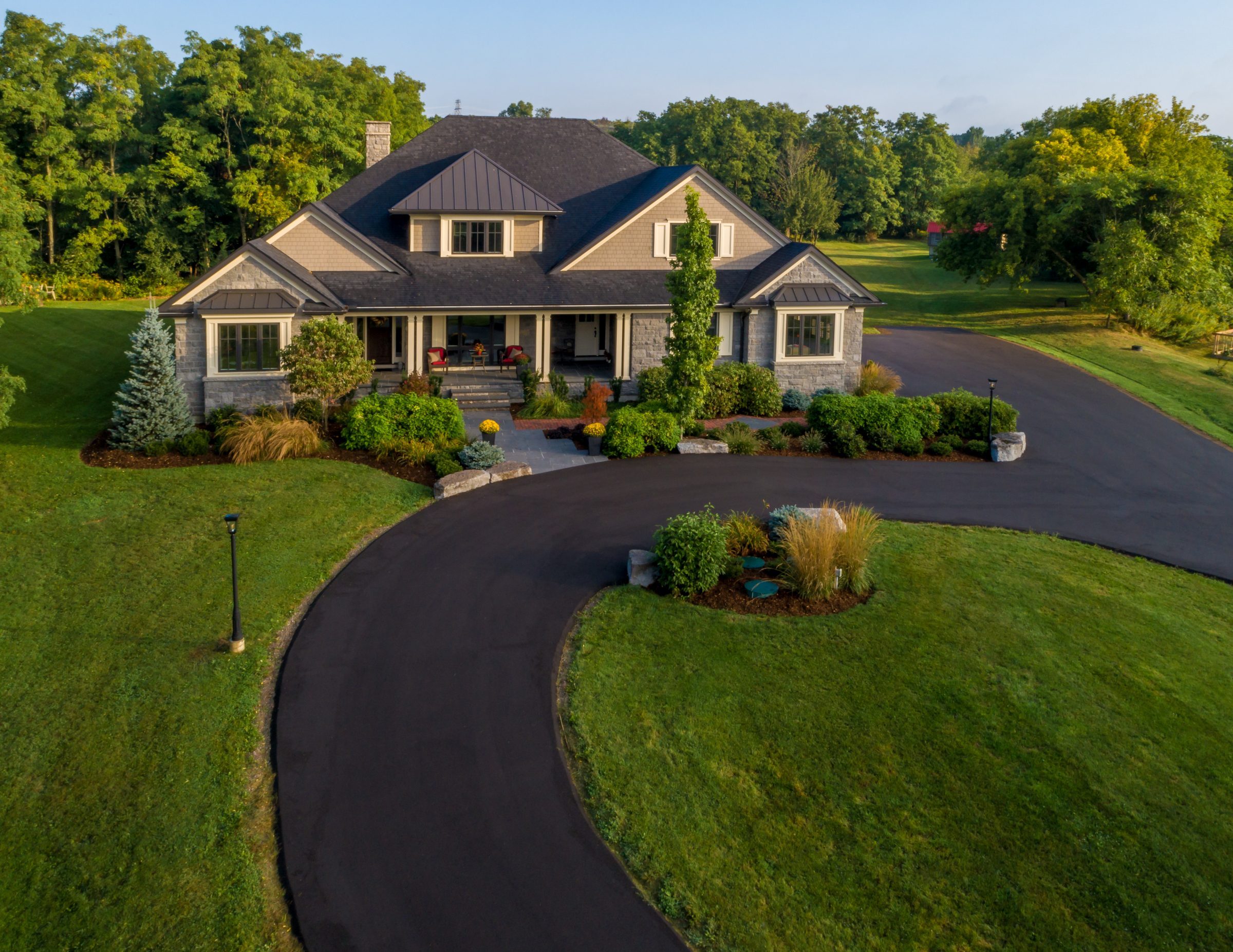 Elegant house with landscaped yard and driveway