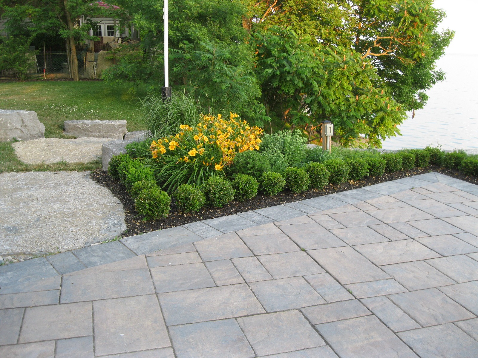Patio with flowers and lake view