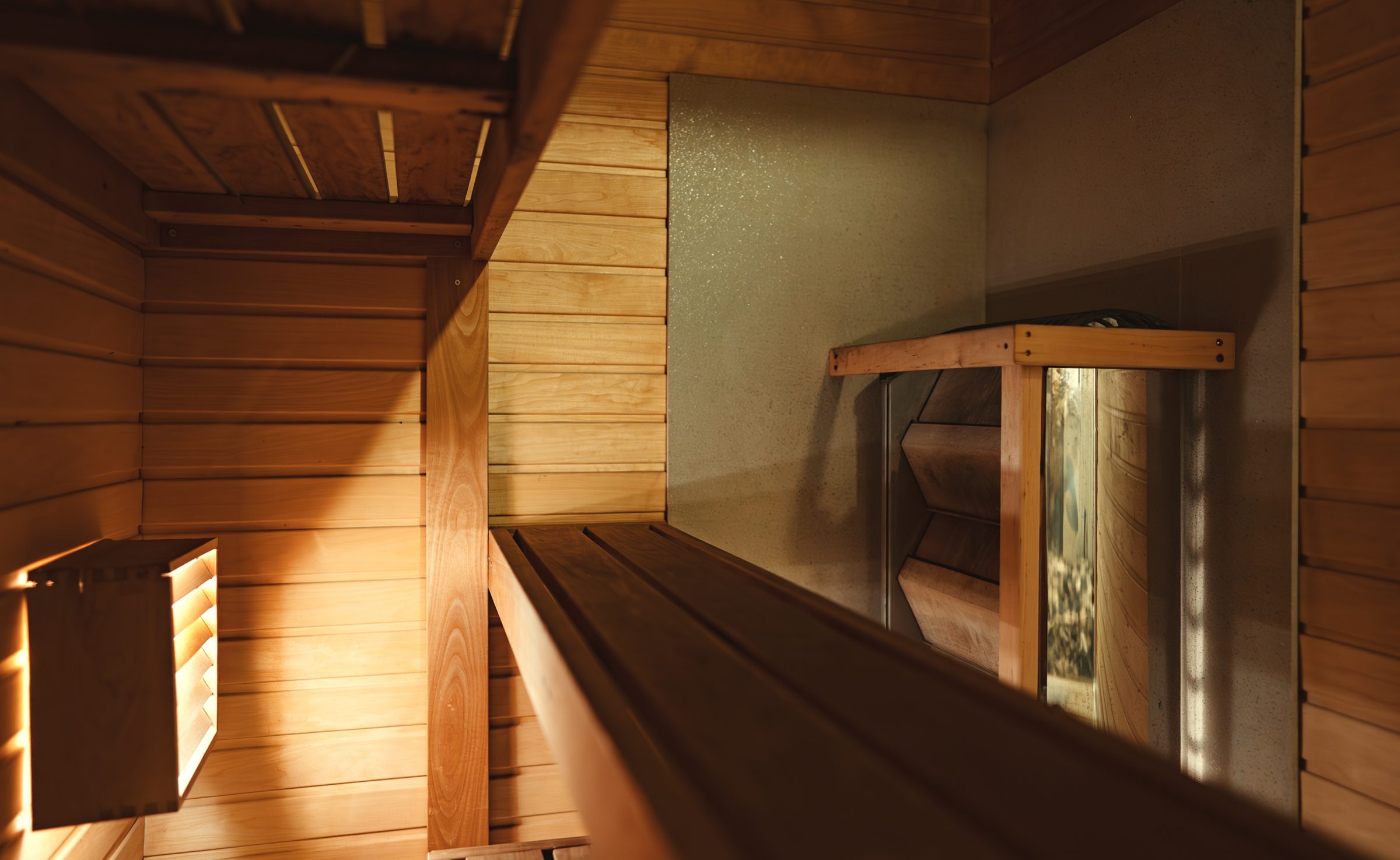 Interior of a wooden sauna with benches.