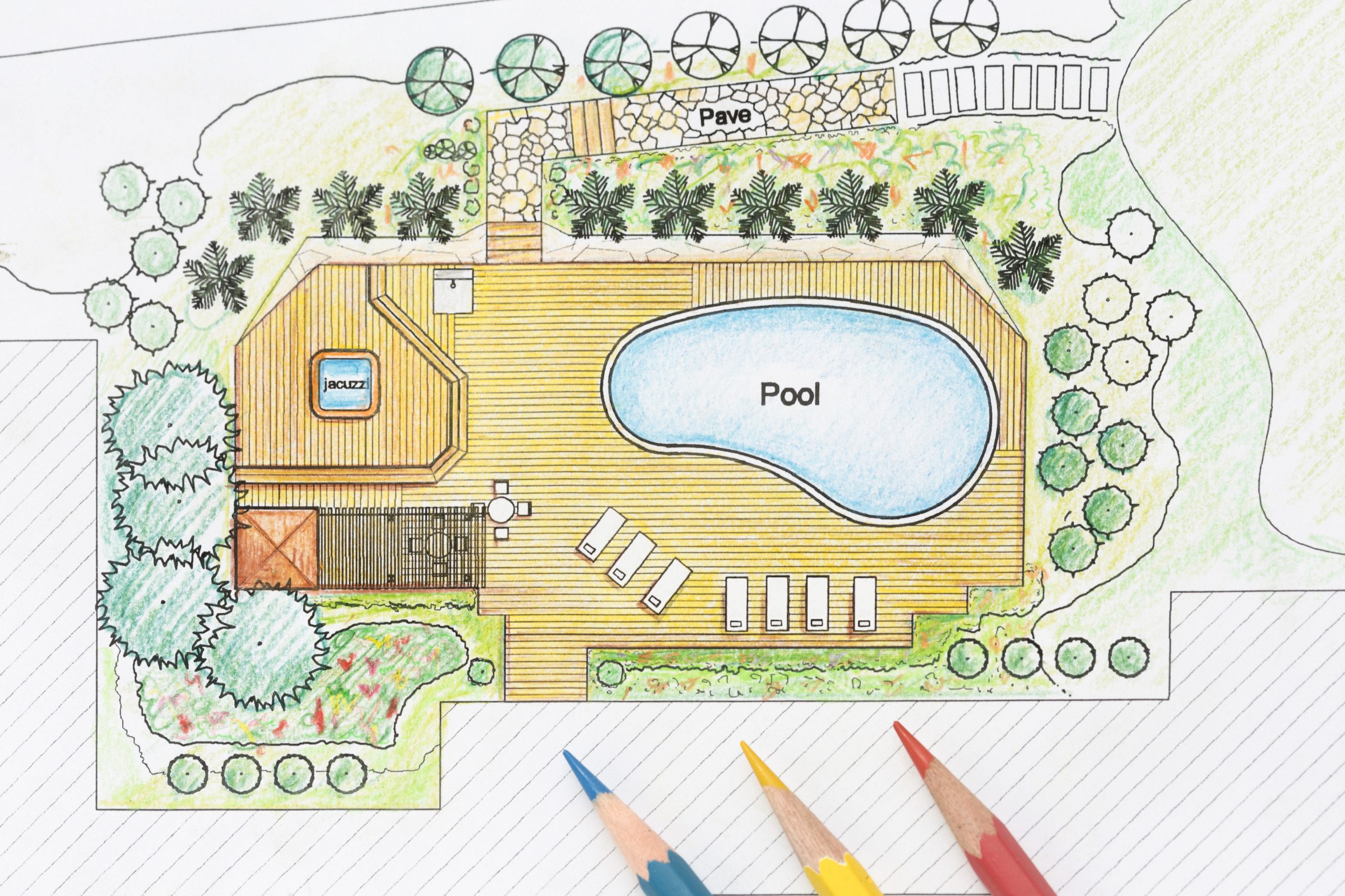 Pool and jacuzzi garden design blueprint with pencils.